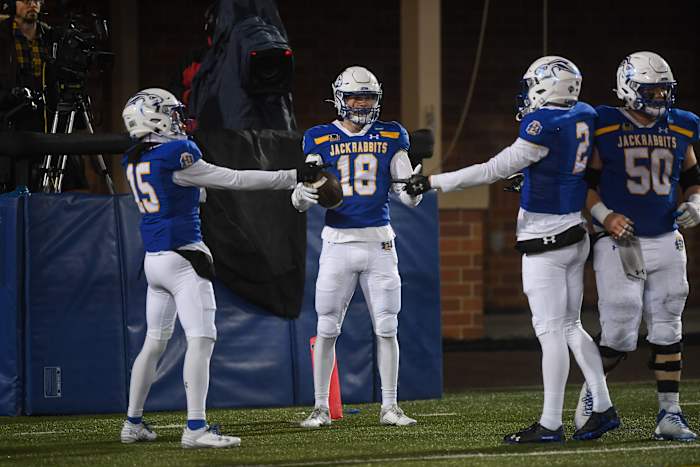 SDSU's wide receiver Griffin Wilde poses with teammates after a touchdown on Friday, Dec. 15, 2023 at Dana J. Dykhouse in Brookings.