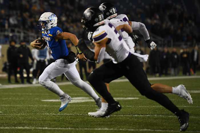 SDSU's quarterback Mark Gronowski (11) runs with the ball on Friday, Dec. 15, 2023 at Dana J. Dykhouse in Brookings.