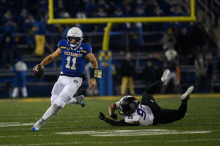 SDSU's quarterback Mark Gronowski (11) runs with the ball on Friday, Dec. 15, 2023 at Dana J. Dykhouse in Brookings.