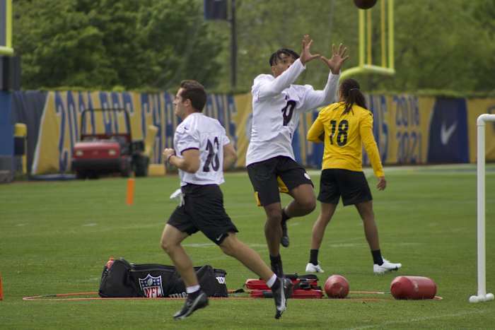 Calvin Austin goes up for a ball during drills.