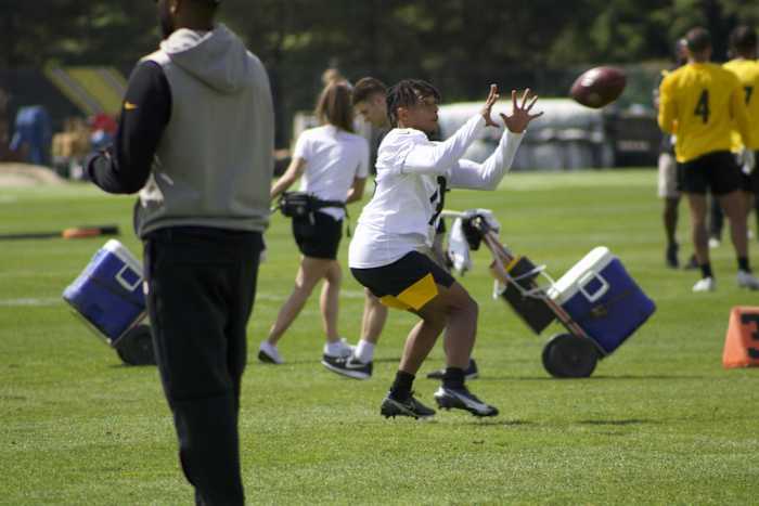 Calvin Austin secures a catch from Kenny Pickett.