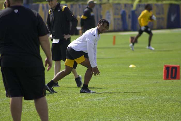 Calvin Austin runs routes during practice.