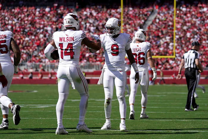 Arizona Cardinals wide receiver Michael Wilson (14) is congratulated by quarterback Joshua Dobbs (9) after catching a touchdown pass against the San Francisco 49ers in the second quarter at Levi's Stadium.