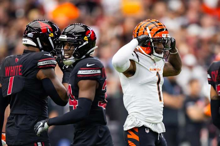 Cincinnati Bengals wide receiver Ja'Marr Chase (1) flexes as he celebrates a first down against the Arizona Cardinals in the first half at State Farm Stadium.