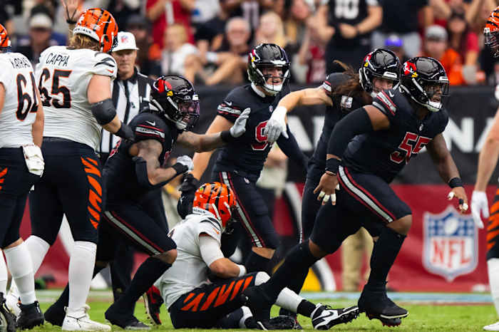 Arizona Cardinals defensive tackle Dante Stills (55) celebrates after sacking Cincinnati Bengals quarterback Joe Burrow in the first half at State Farm Stadium.