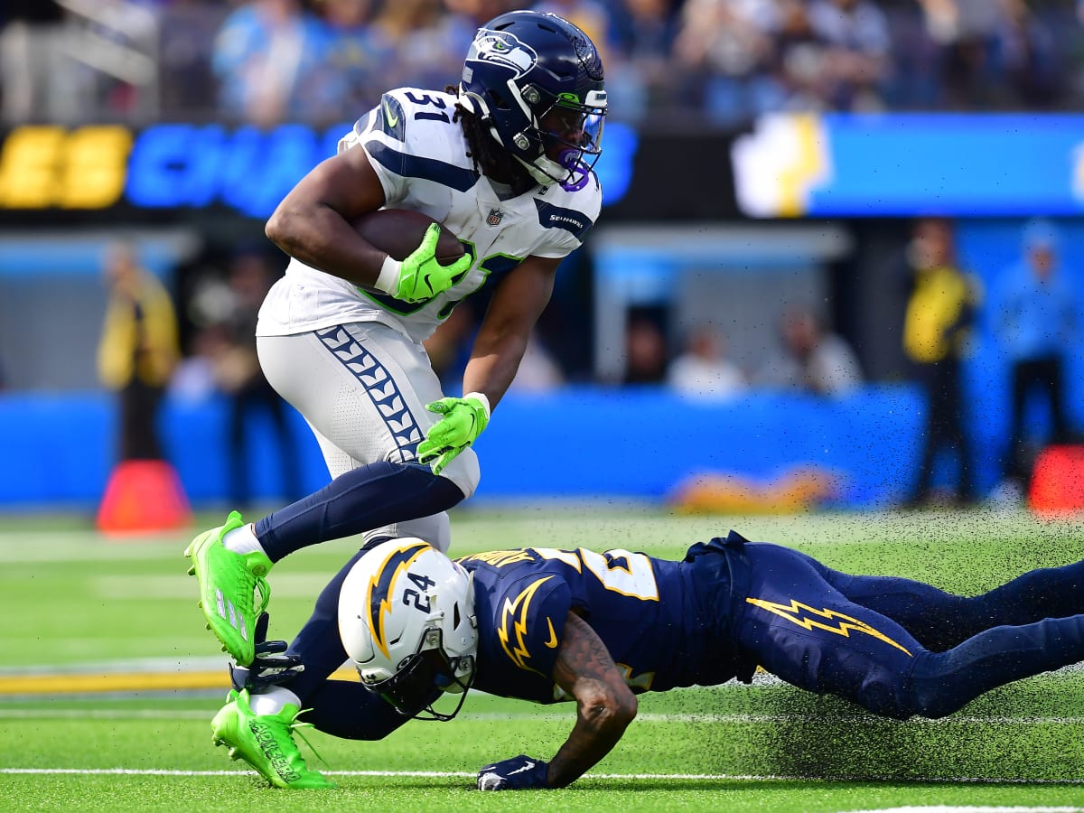 Seattle Seahawks running back DeeJay Dallas celebrates after