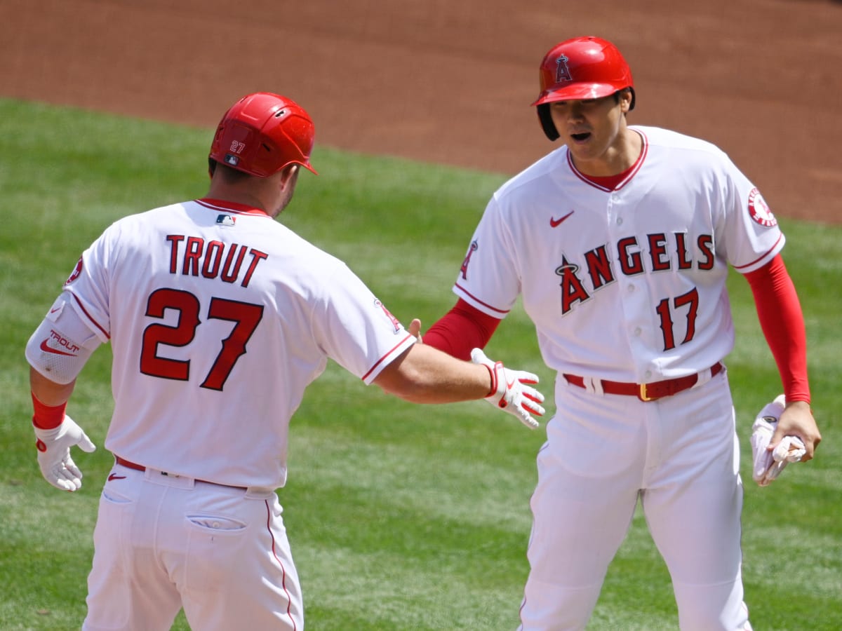 Shohei Ohtani of the Los Angeles Angels puts on pink cleats to celebrate  Mother's Day before a baseball game against the Cleveland Guardians at  Progressive Field in Cleveland, Ohio, on May 14