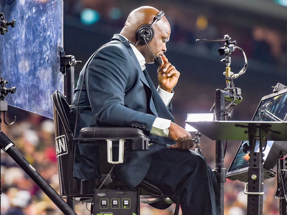 TV Analyst Booger McFarland looks on the sideline during an NFL