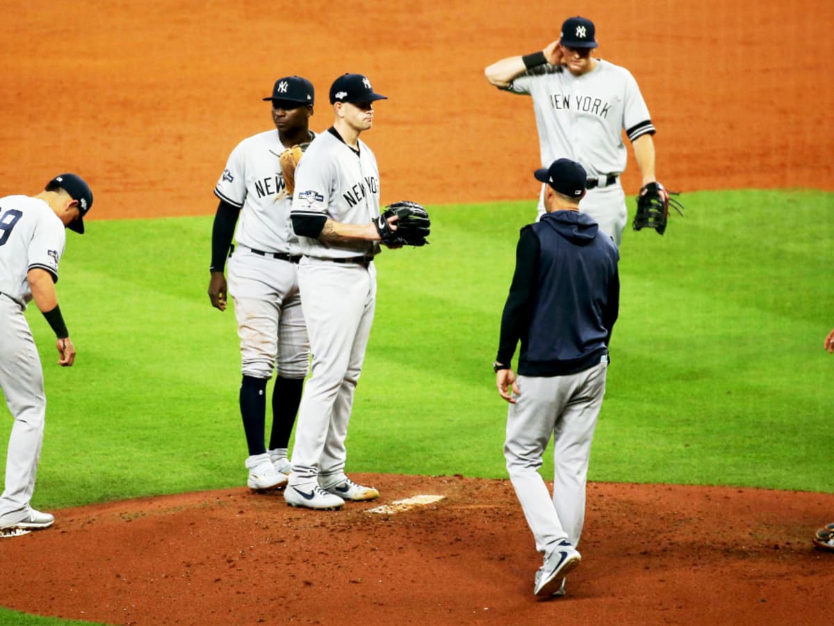 New York Yankees manager Aaron Boone walks to the mound to relieve