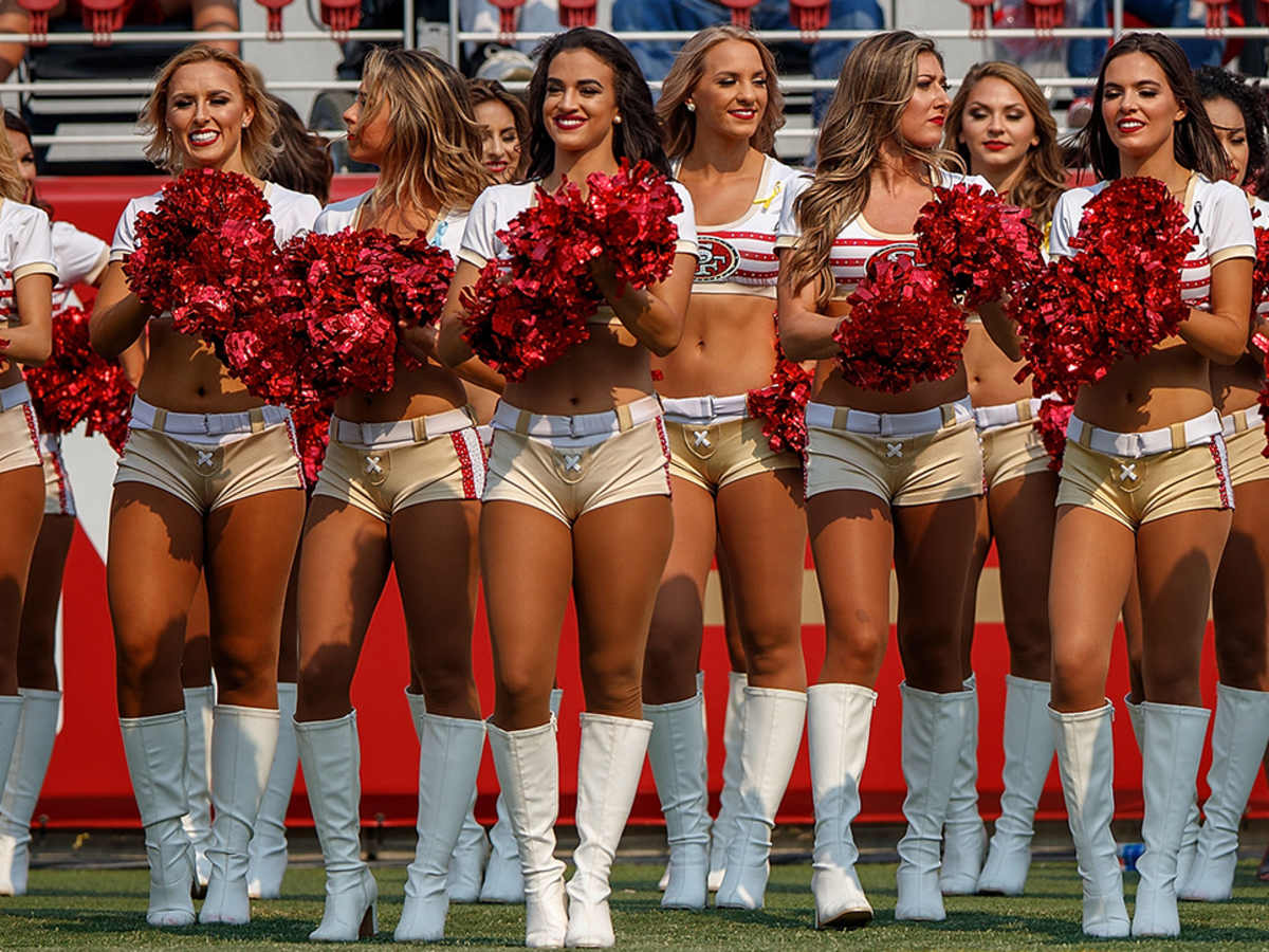 San Francisco 49ers cheerleader takes a knee during national anthem