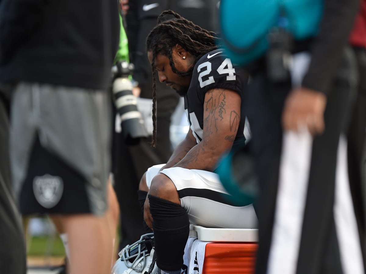 Raiders Marshawn Lynch sits during anthem before Oakland-Arizona game