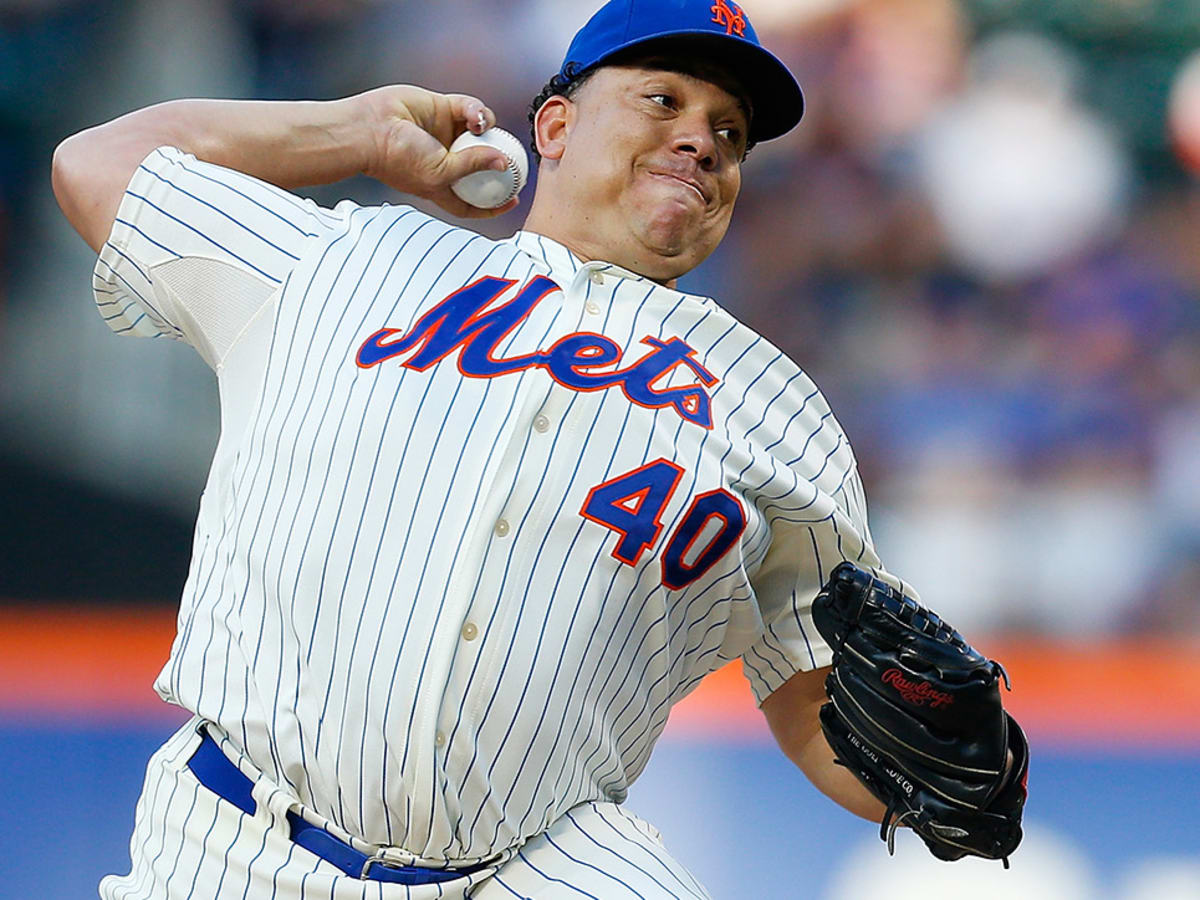 Oakland A's pitcher Bartolo Colon throws to the Seattle Mariners