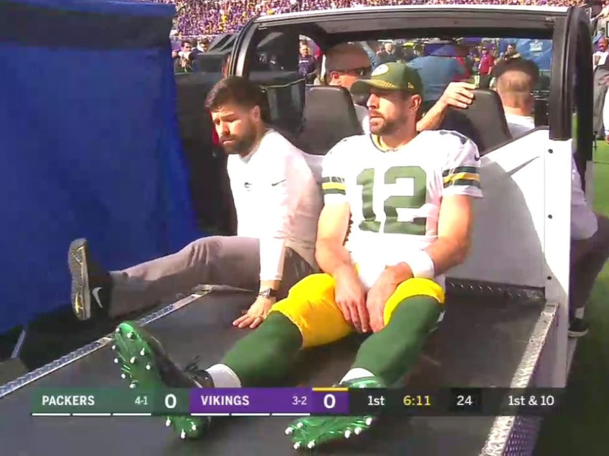 Packers quarterback Aaron Rodgers injured during Bears game, leaves on cart