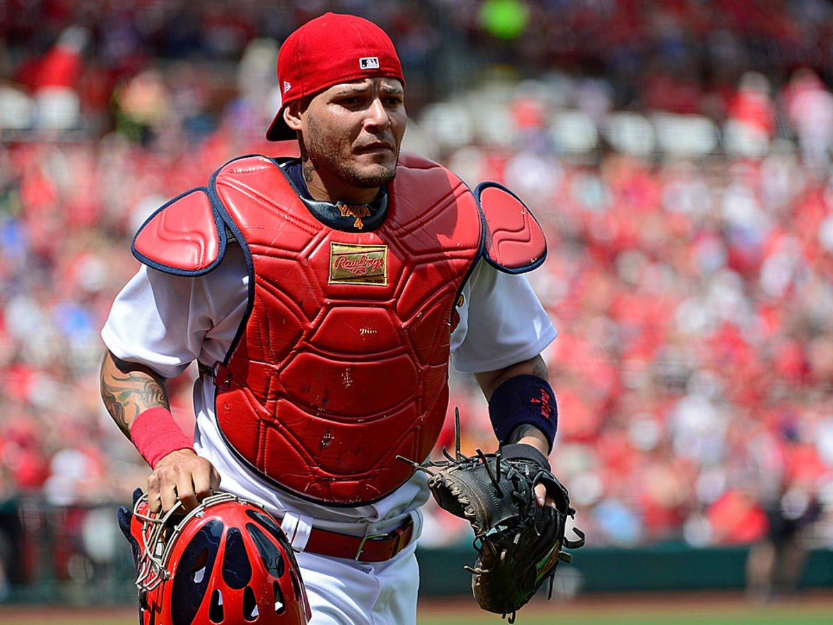 St. Louis Cardinals catcher Yadier Molina throws the baseball in