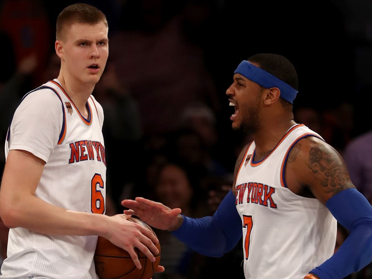 New York Knicks Kristaps Porzingis and Carmelo Anthony walk to the bench  when a the out is called in the second half against the Detroit Pistons at  Madison Square Garden in New