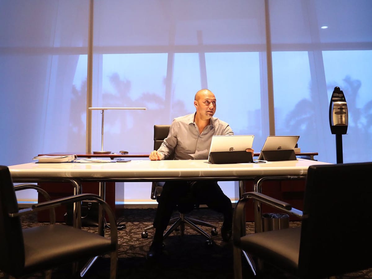 Miami Marlins baseball team CEO Derek Jeter, center, speaks to members of  the media inside Marlins Park stadium, Monday, Feb. 11, 2019, in Miami.  Jeter is entering his second season as CEO