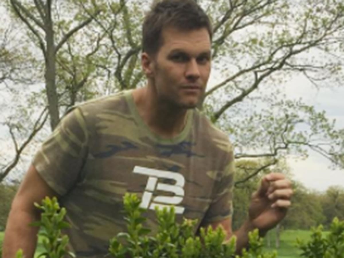 Camouflaged Tom Brady goes into the woods to sell his newest shirt - Sports  Illustrated