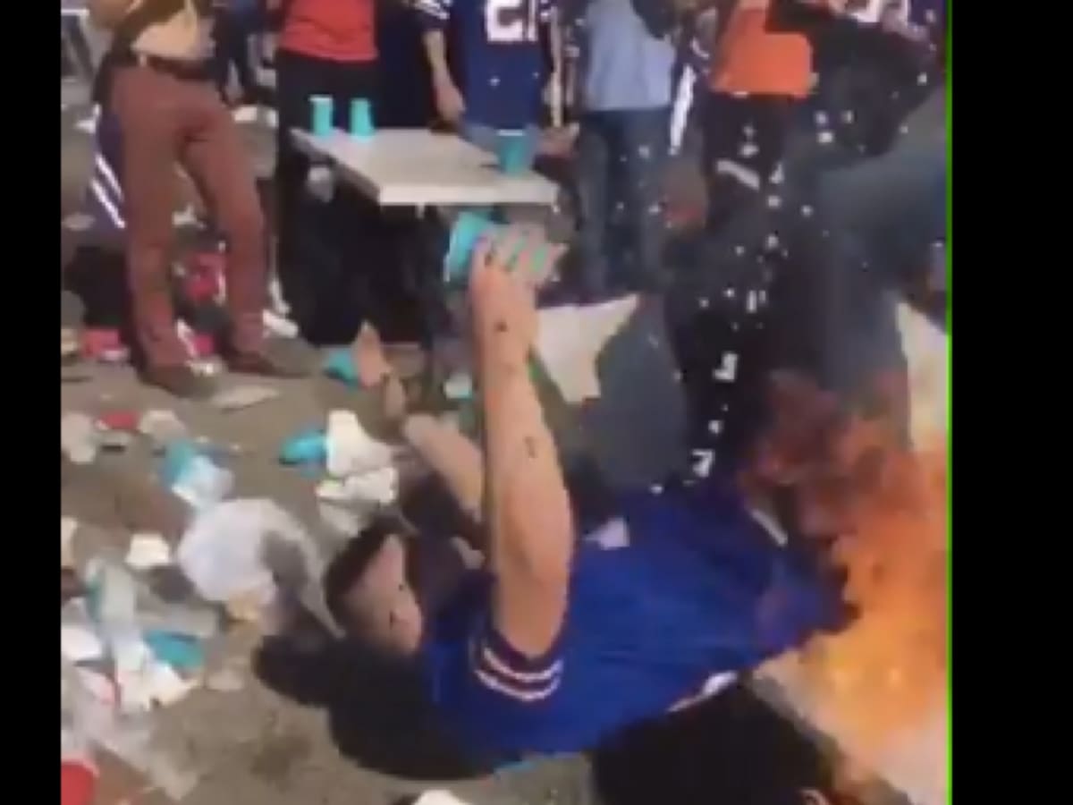 VIDEO: Bills tailgate gets crazy, fan gets slammed through table 