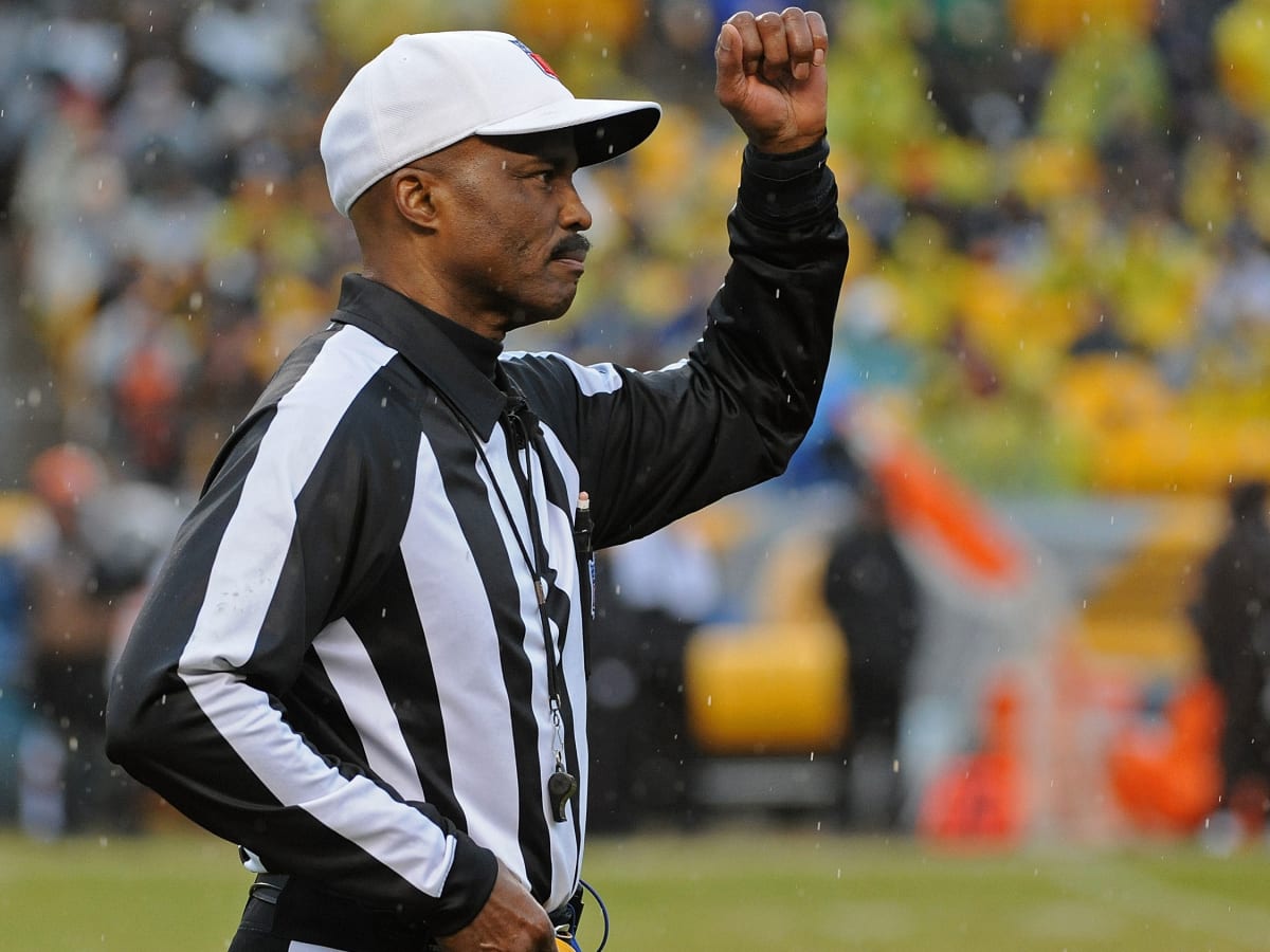 09 January 2011: NFL referee Mike Carey comes back on the field after going  under the sideline replay booth. In the Sunday AFC wildcard game the  Baltimore Ravens defeated the Kansas City