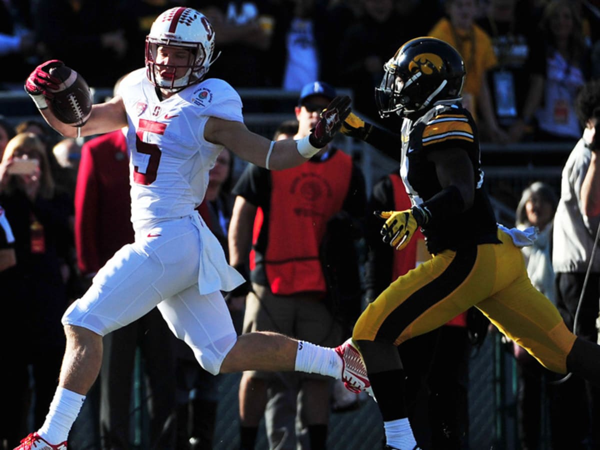 Christian McCaffrey Stanford Cardinal Unsigned Cardinal Jersey Rushing For  Touchdown Photograph