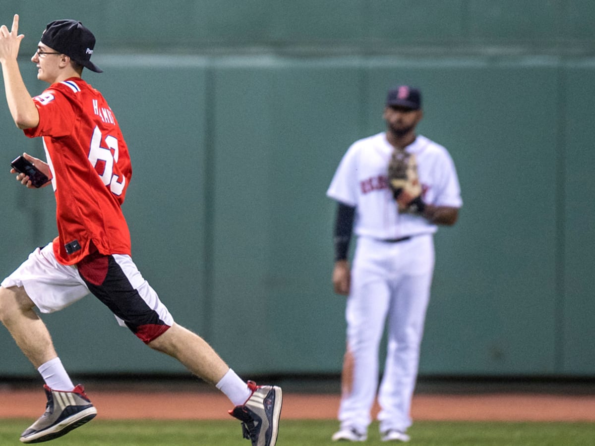 Fan in 'Harambe 69' jersey runs on field in Boston - Sports