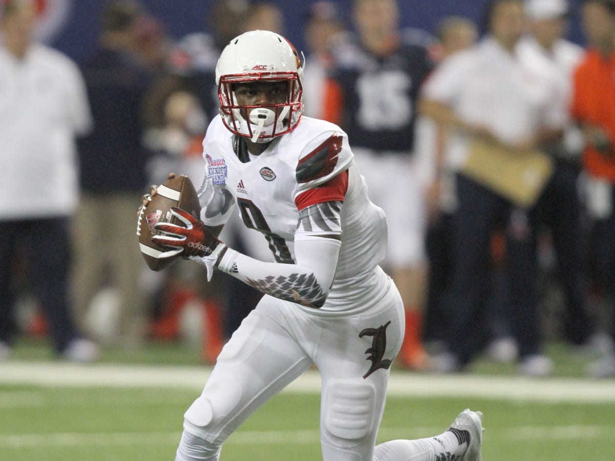 Lamar Jackson Louisville Cardinals Unsigned White Jersey Rolling Away vs. Auburn Tigers Photograph