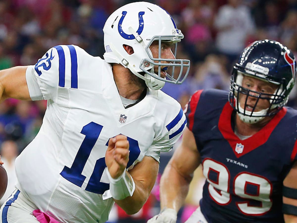 Indianapolis Colts' Andrew Luck (12) throws as Houston Texans' J.J. Watt  (99) applies pressure during the first quarter of an NFL football game,  Thursday, Oct. 9, 2014, in Houston. (AP Photo/David …