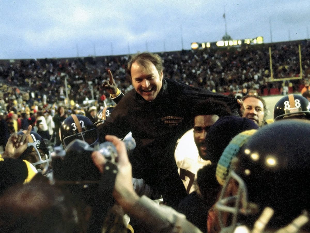 Pittsburgh Steelers coach Chuck Noll wears a happy face as he watches his  team workout at training camp in Thousand Oaks, Calif., Dec. 27, 1983. The  Steelers, escaping from the bitter weather