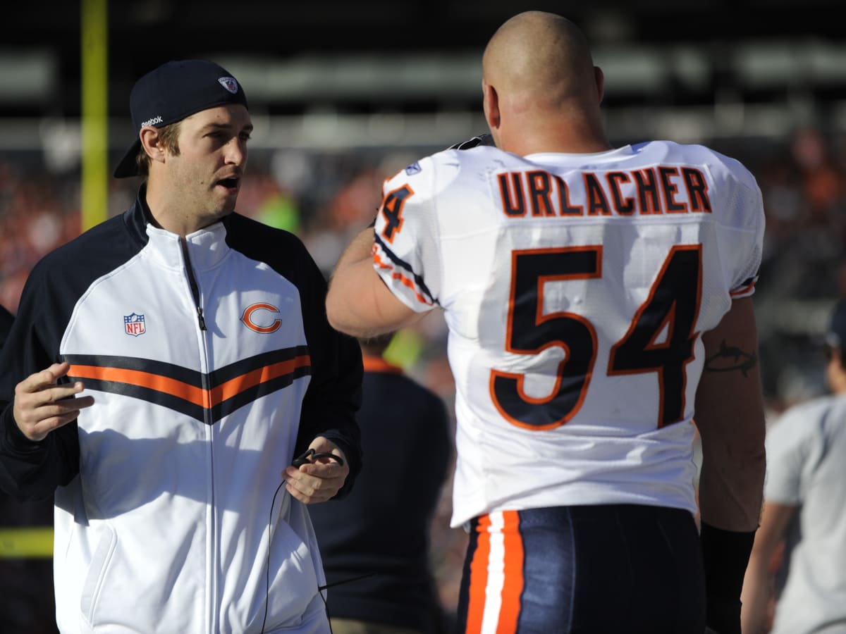 Chicago Bears linebacker Brian Urlacher (54) and quarterback Jay Cutler (6)  stand on the sidelines during