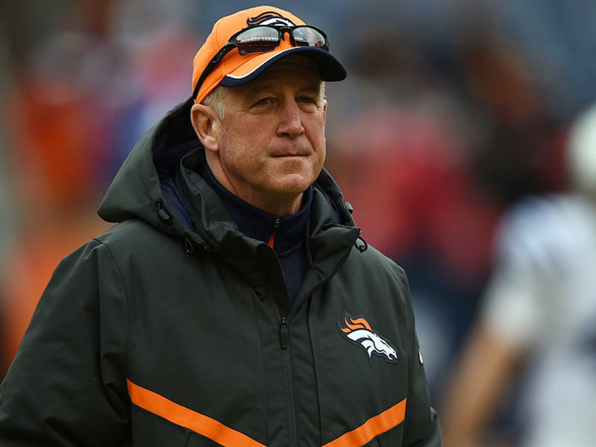 Denver Broncos head coach John Fox watches a video replay board in