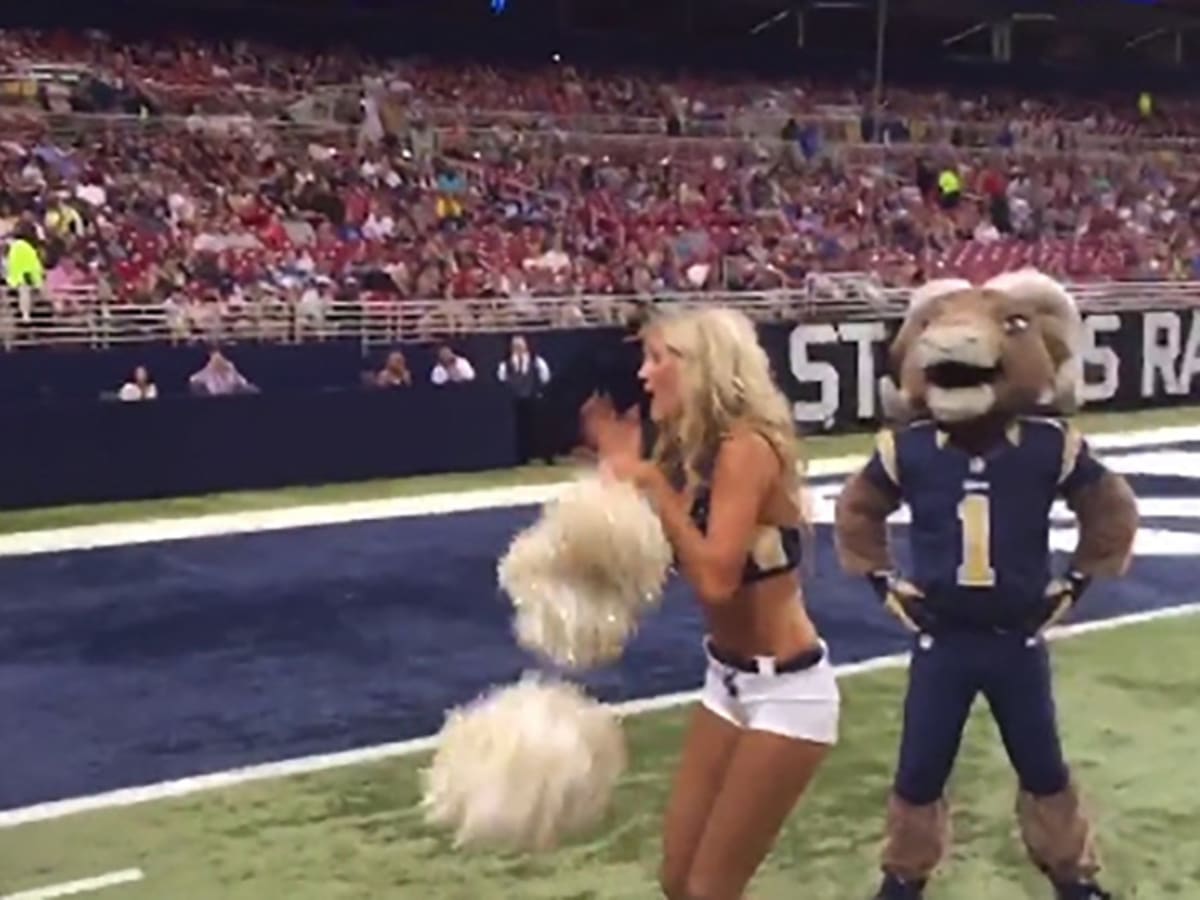 A St. Louis Rams cheerleader entertains the crowds during a game