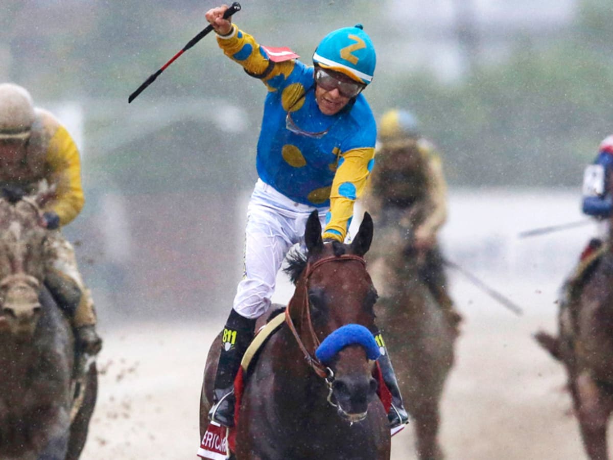 Triple Crown winning jockey Victor Espinoza waves to the crowd before  throwing out the ceremonial first pitch before the baseball game between  the Arizona Diamondbacks and San Diego Padres in a baseball