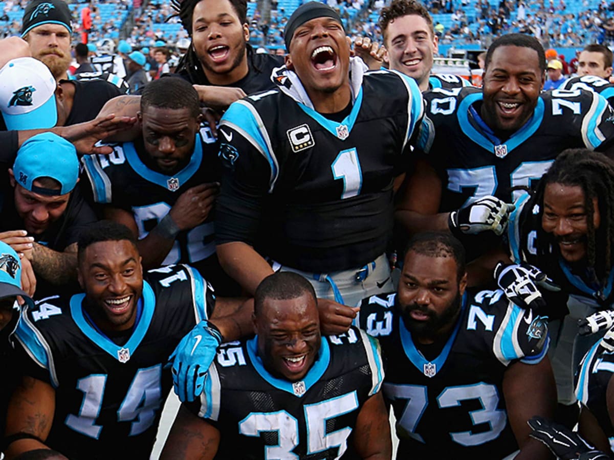 Carolina Panthers quarterback Cam Newton talks on the sidelines as the  Panthers play the Los Angeles Rams in the second half of an NFL football  game in Charlotte, North Carolina on September