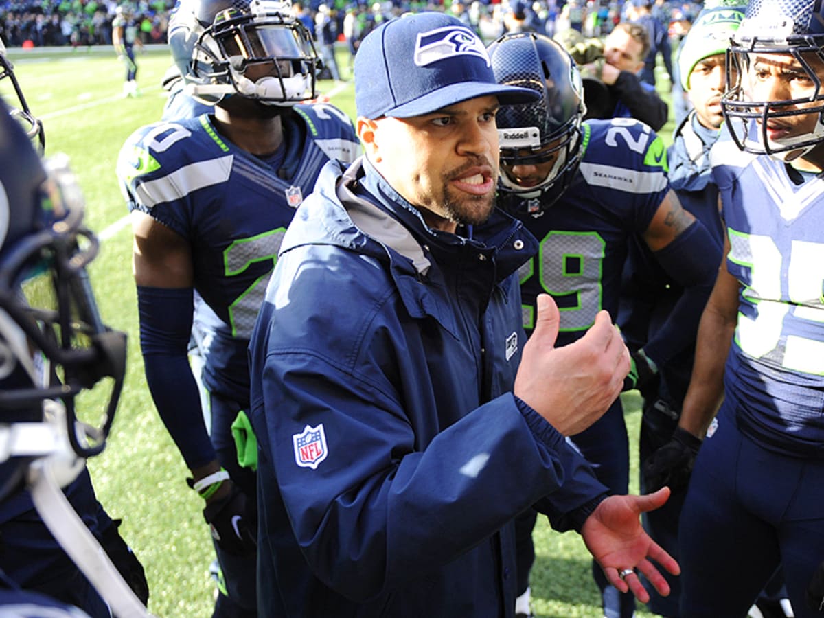 Seahawks defensive coodinator Kris Richard makes a tough phone