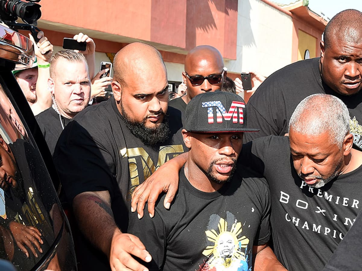 Floyd 'Money' Mayweather is surrounded by special forces guards