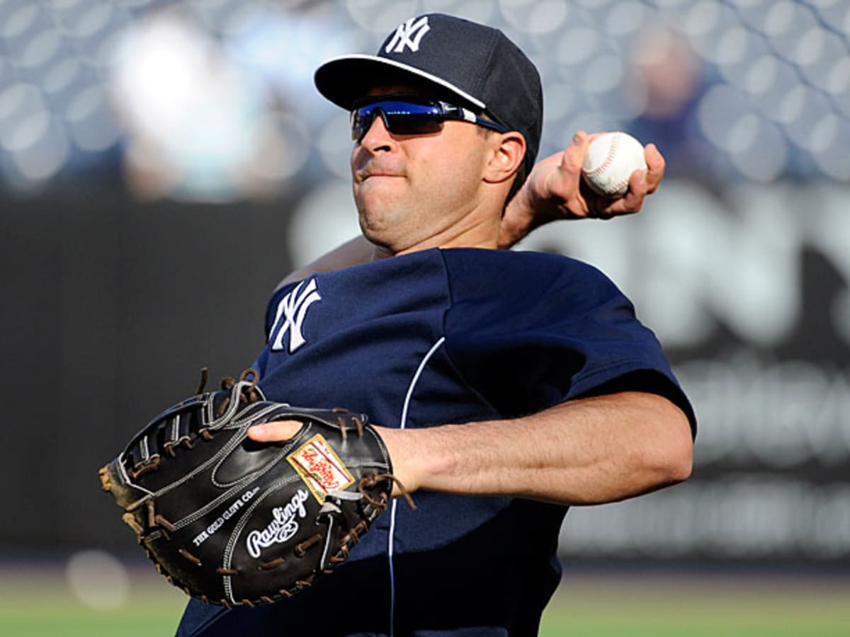 New York Yankees' Mark Teixeira is hit by Philadelphia Phillies