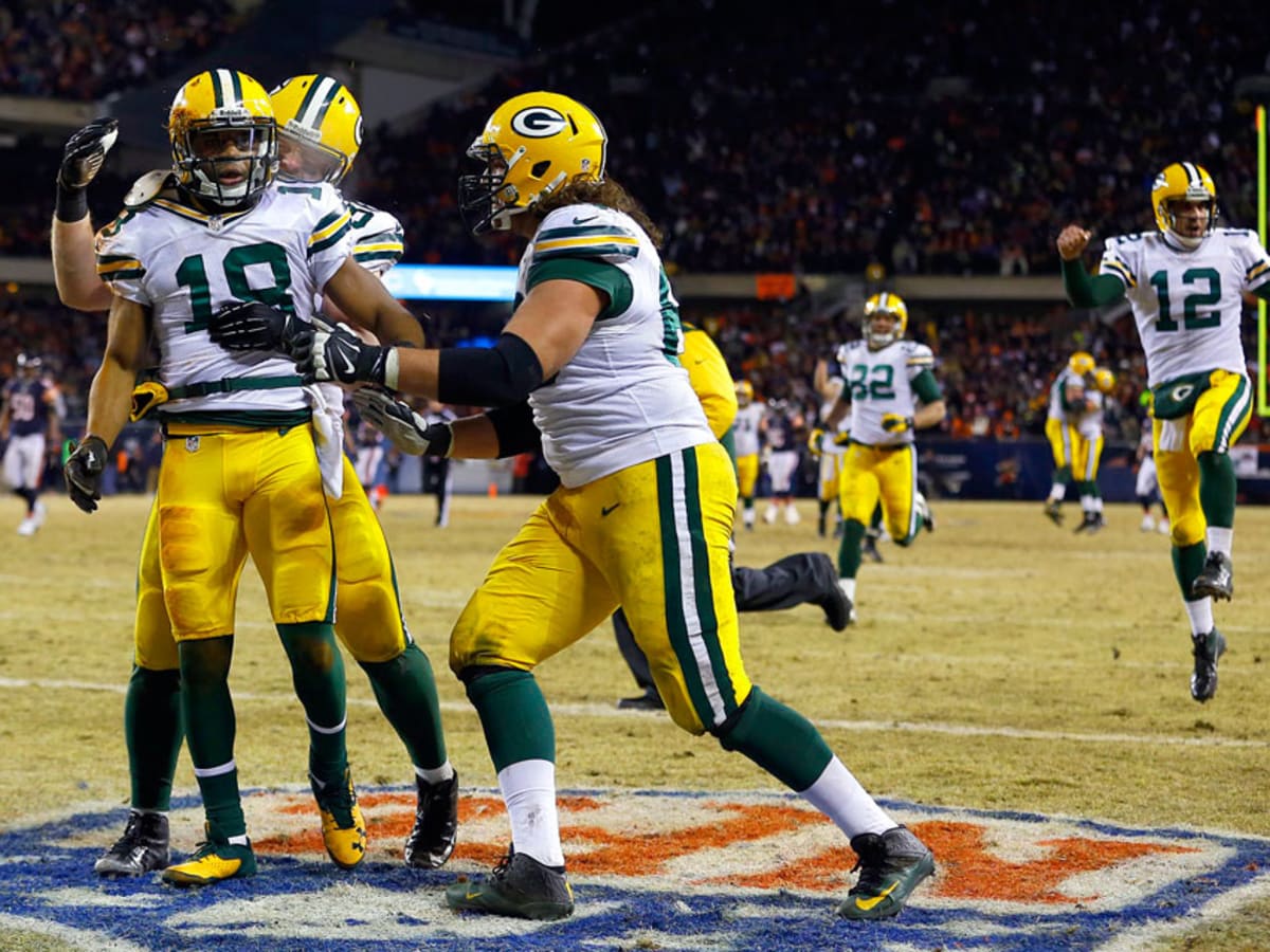 Green Bay Packers' Randall Cobb makes snow angel in end zone