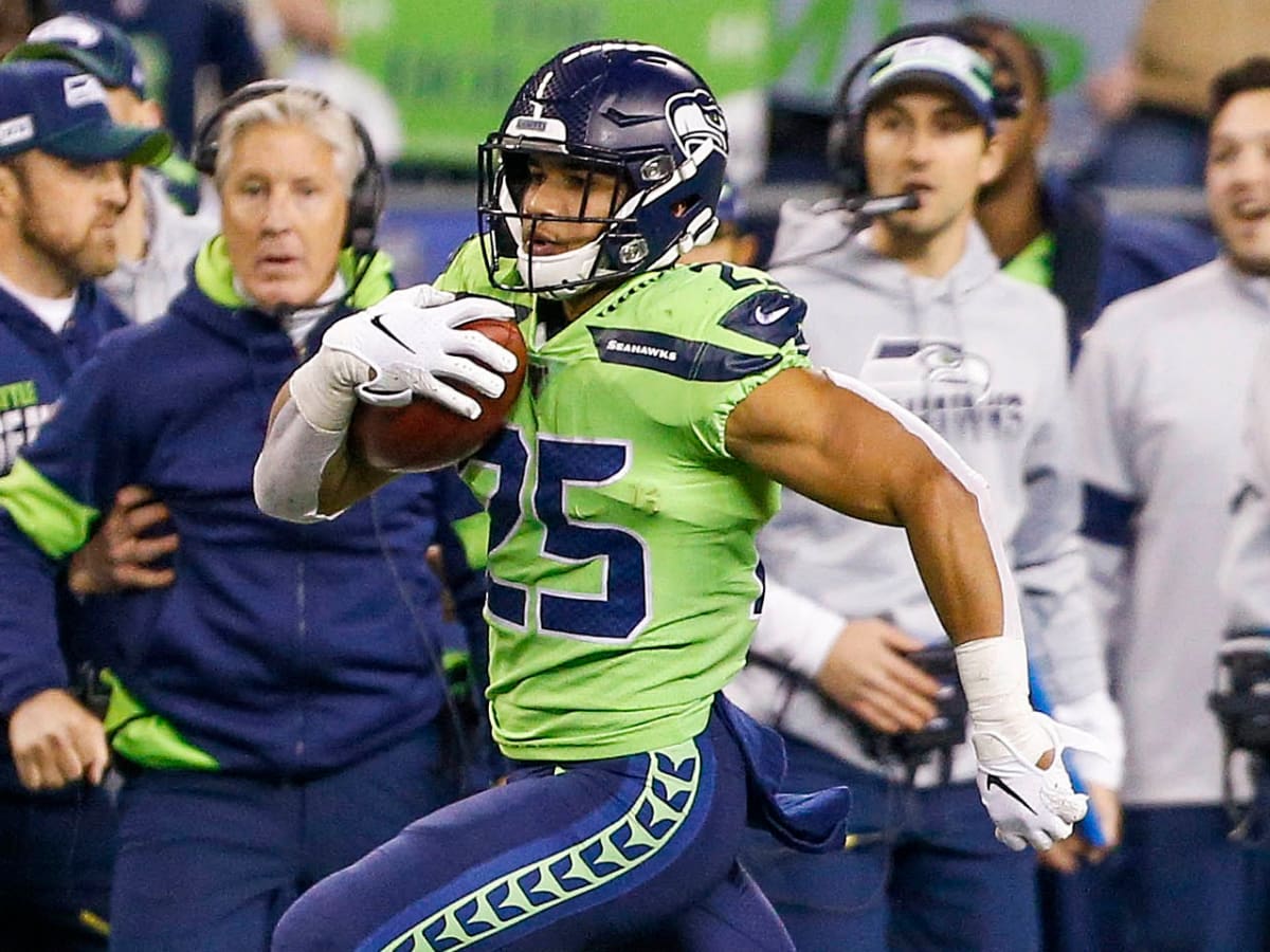 Seattle Seahawks running back Travis Homer reacts during an NFL