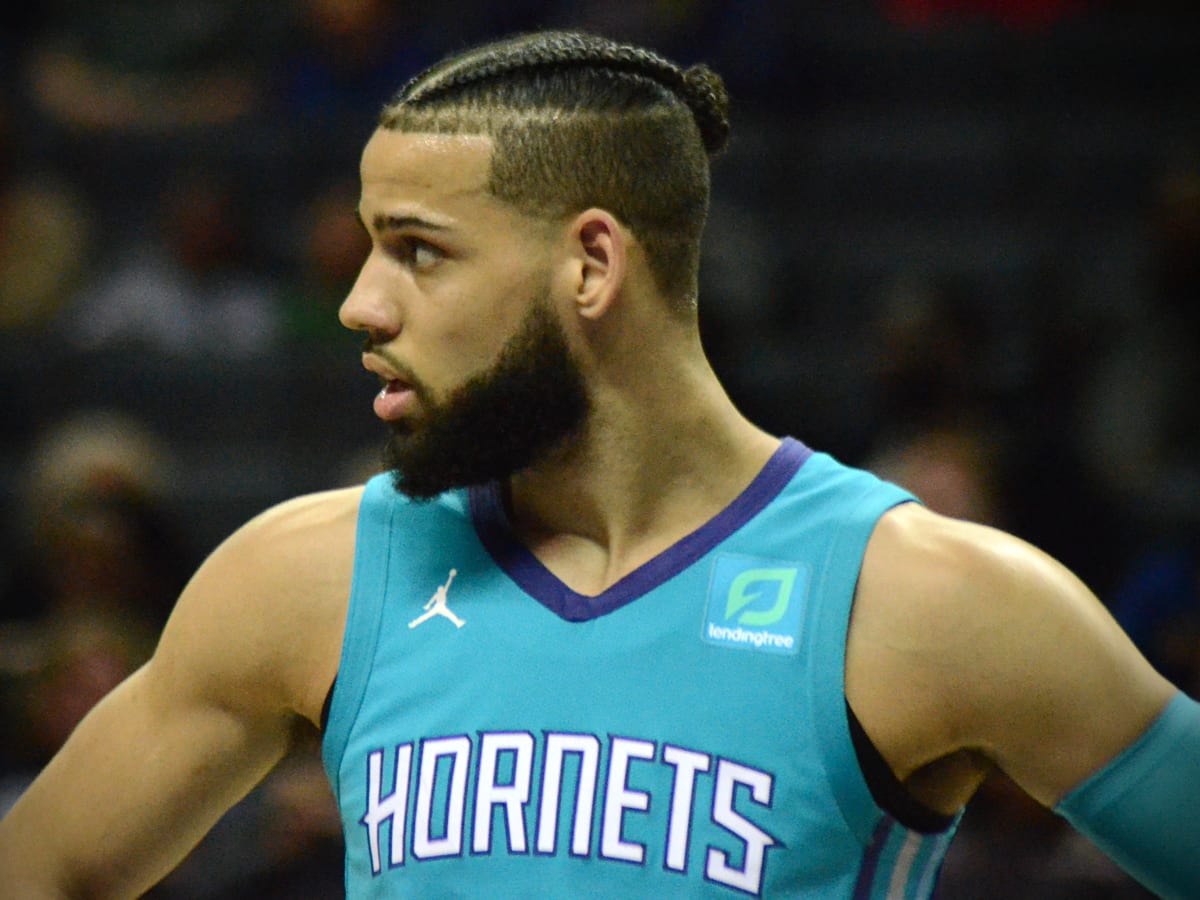 Charlotte Hornets' Cody Martin (11) shakes hands after playing