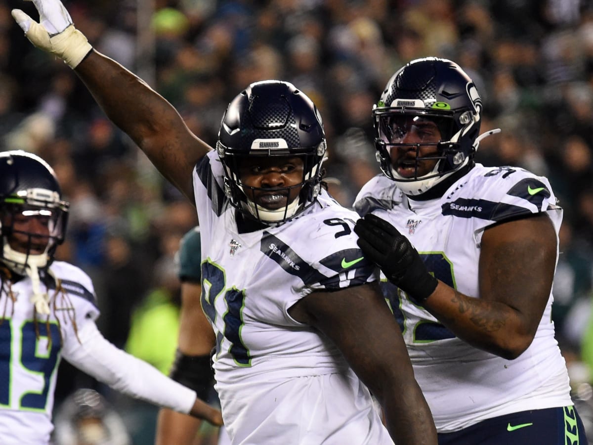 Seattle Seahawks' Jarran Reed (90) celebrates with Quinton