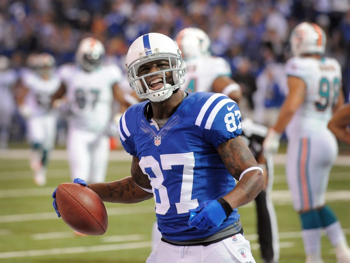 Indianapolis Colts wide receiver Reggie Wayne (87) is hit by New