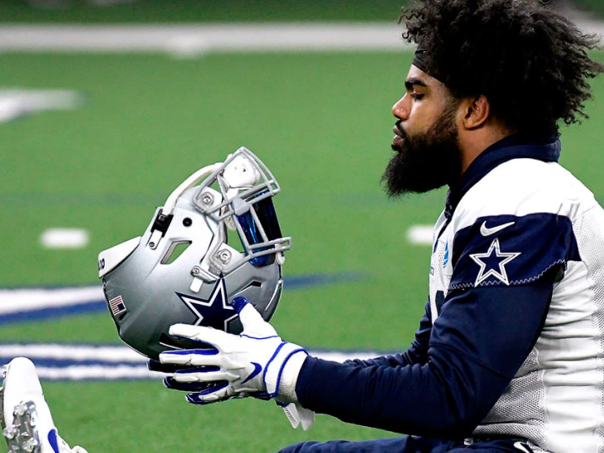 Cowboys RB Ezekiel Elliott sits out practice with knee discomfort