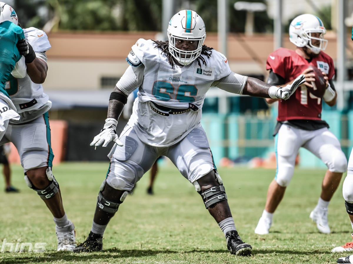 Dolphins OL Solomon Kindley donates 66 laptops to students