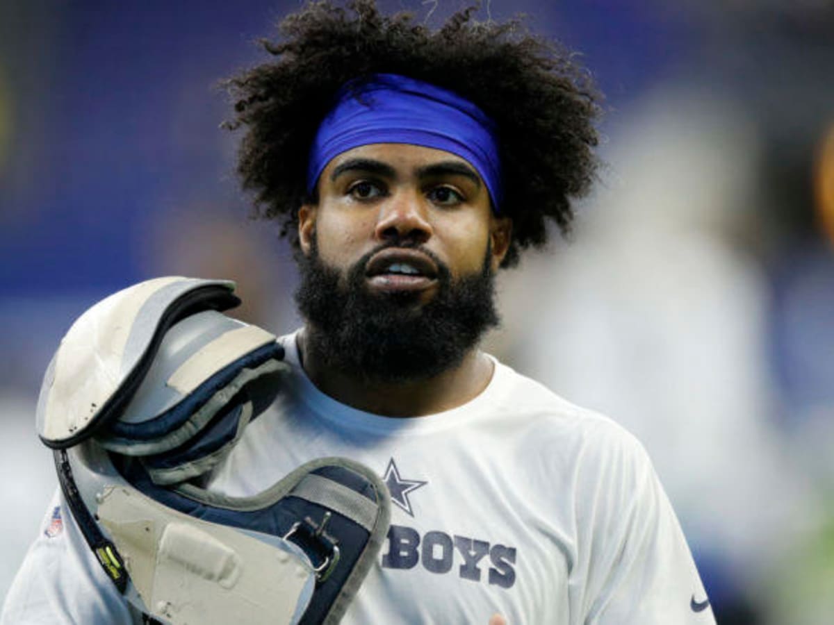 Watch as Cowboys RB Ezekiel Elliott surprises new pet owners at adoption  event at SPCA of Texas