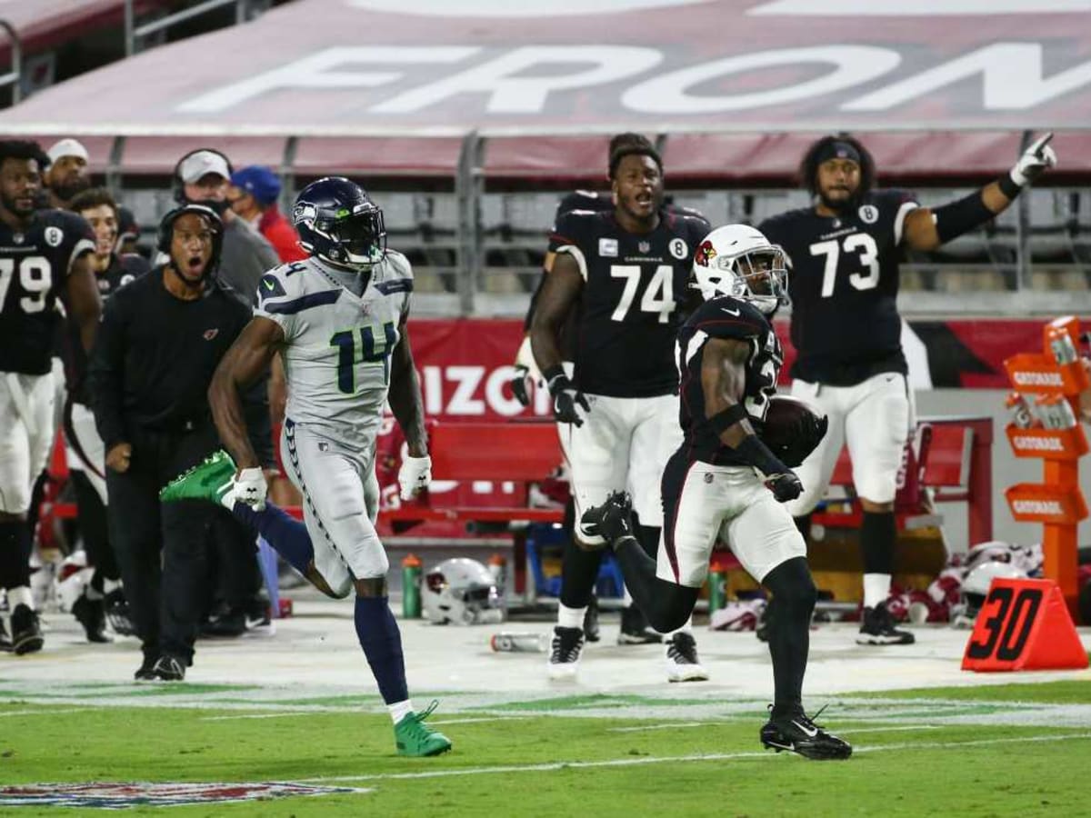 Seattle Seahawks wide receiver DK Metcalf is tackled in the endzone by  Atlanta Falcons safety Jaylinn Hawkins after catching a pass for a  touchdown in an NFL football game, Sunday, Sept. 25