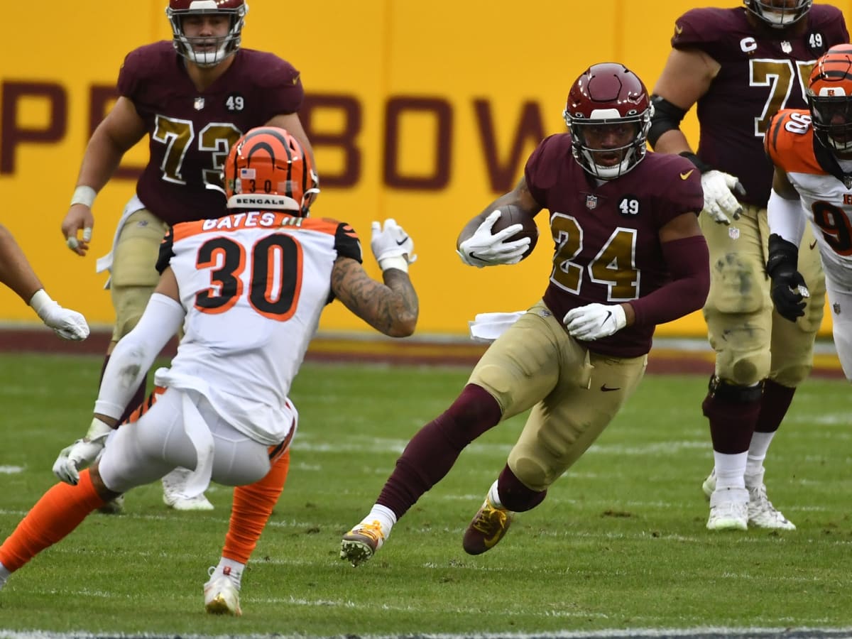 Washington Commanders running back Antonio Gibson shakes tackle on