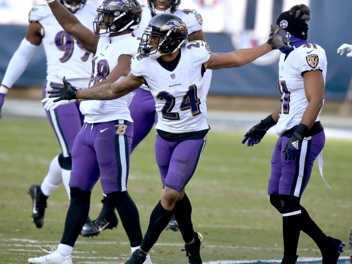 Ravens players dance on Titans' logo after fourth-quarter INT