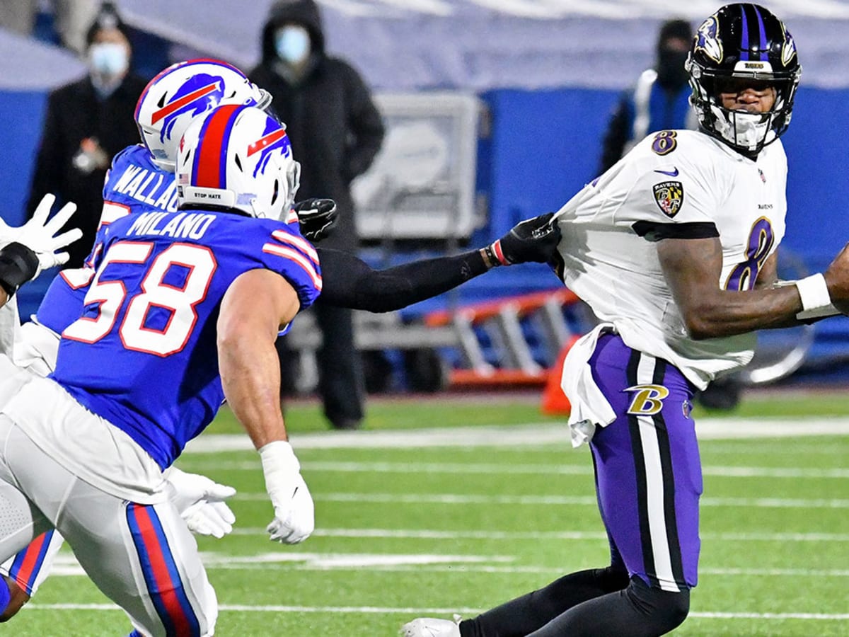 Ravens players dance on Titans' logo after fourth-quarter INT