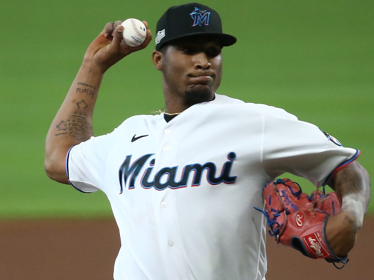 Miami Marlins' Lewis Brinson (9) strikes out with runners on base