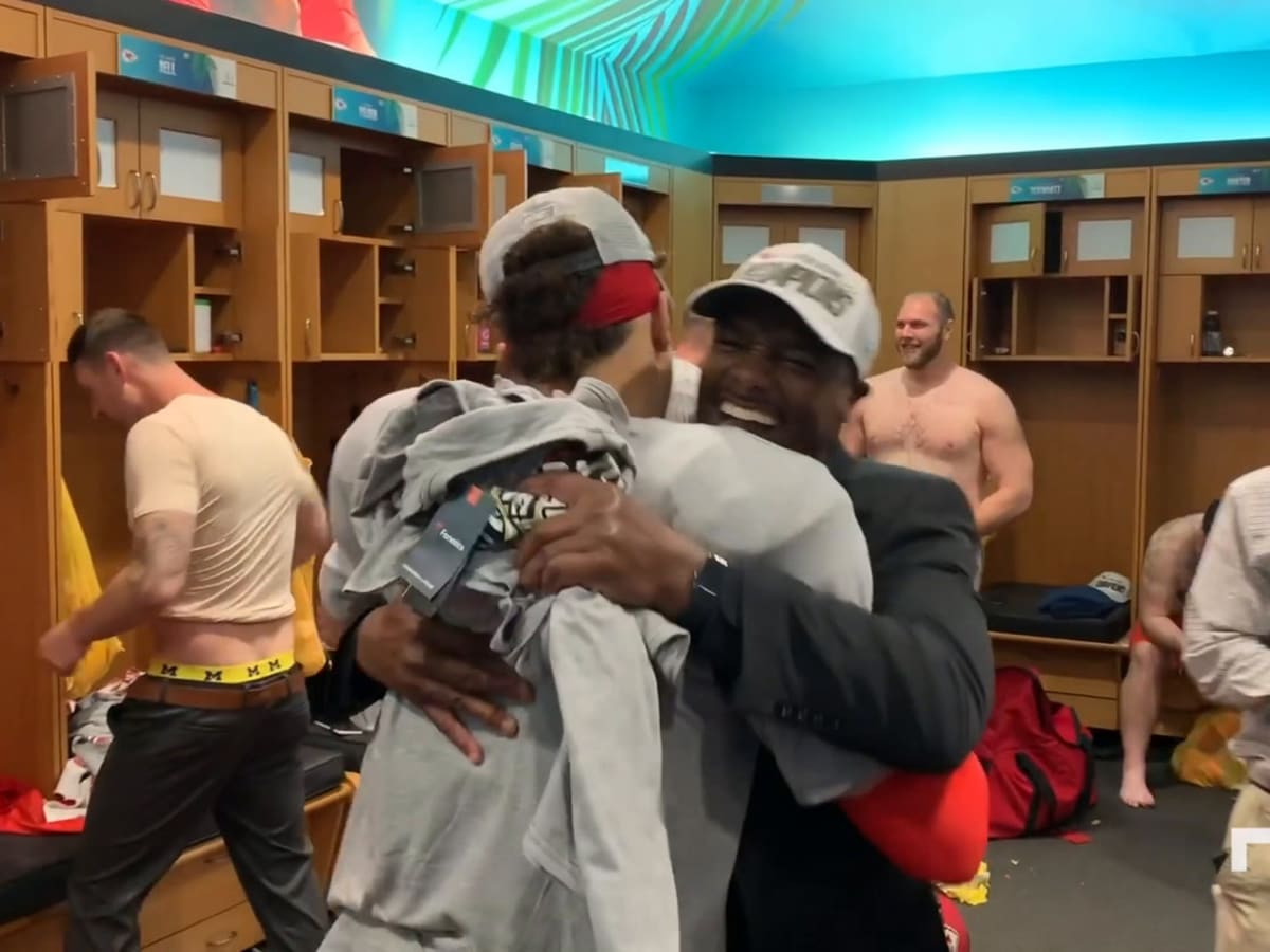 Locker room celebration after comeback victory vs. Raiders